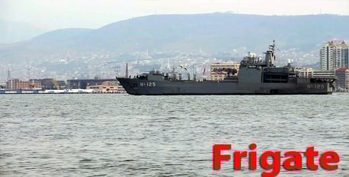 Gray Battleship Travels in the Ocean near City