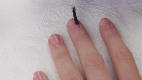 Clear Nail Polish Applied To Pink Nails