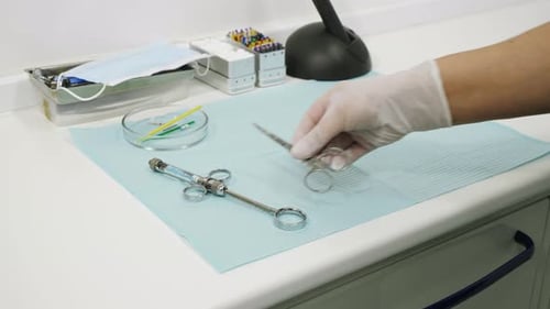 Dentist Prepares Tools for Medical Procedure