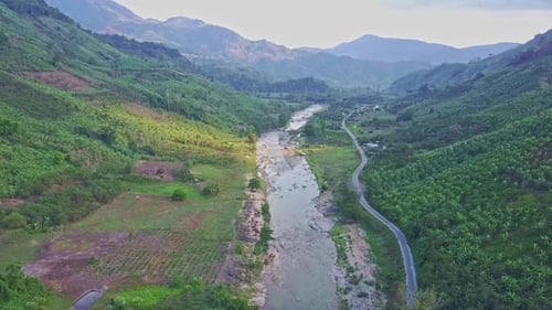 Panoramic View Rocky River Near Road Between Hilly Landscape