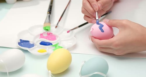 Painting on egg for Easter holiday