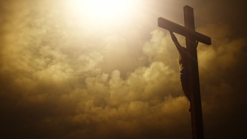 Jesus Christ on Cross with Moving Clouds and Divine Light
