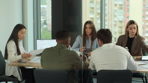 Multiethnic Team of Startup Entrepreneurs Software Engineers Have Meeting in the Modern Office