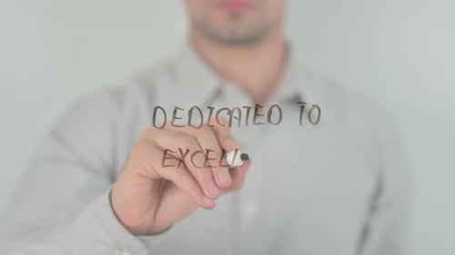 Hand Writing Dedicated to Excellence With Marker