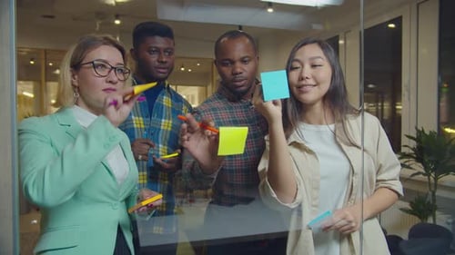 Diverse Business Colleagues Discussing Ideas at Office