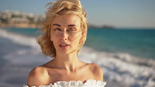 Closeup Portrait of Gorgeous Sensual Young Woman Posing in Sunshine at Picturesque Mediterranean Sea