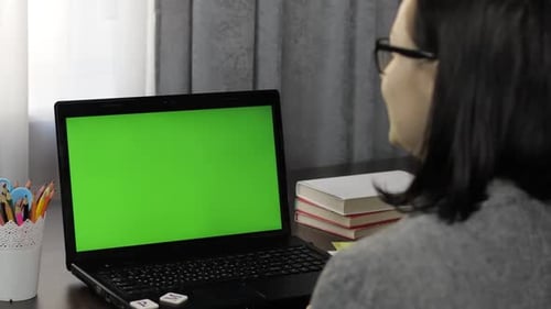 Woman Teacher Making Online Distance Education Video Call on Laptop Green Screen