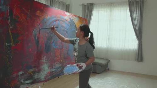 Teen Artist Painting Large Abstract Colorful Canvas