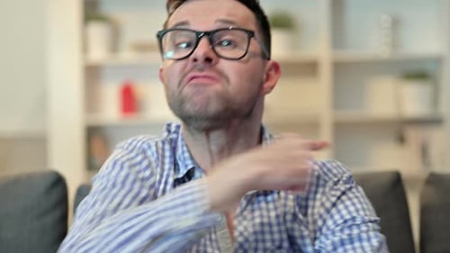 Man Angrily Gesturing and Making a Point