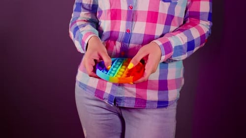 Close Up of Unrecognizable Person Playing with Pop It