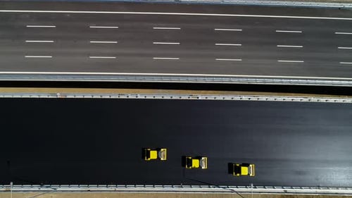 Road Rollers Leveling Fresh Asphalt Pavement