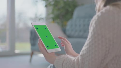 Woman Tapping Tablet with Chroma Key