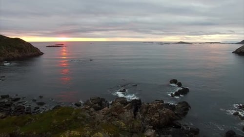 Couple watching midnight sun in Norway, Vesteralen