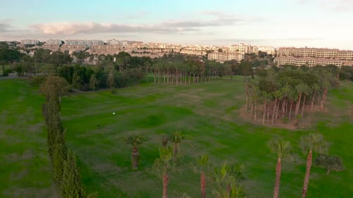 Aerial View. Empty Golf Course. Breathtaking Sunset Shining on Golf Course