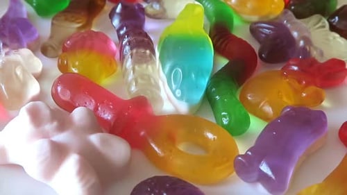 Colorful Gummy Candies Assortment on White Surface