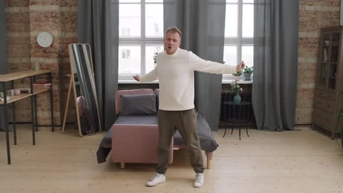 Man Dancing in Apartment