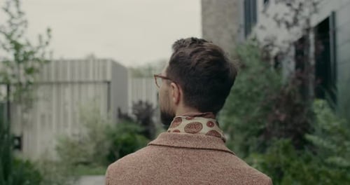 Backside View of Stylish Male Person in Suit with Neckerchief Walking at City Street