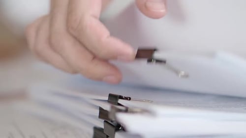 Male Hand Takes Folders in the Office, One By One