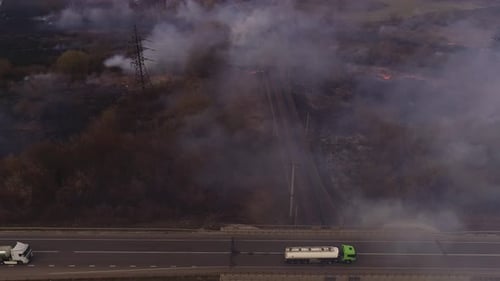 Aerial View of Wildfire Burning Near Highway