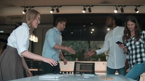 Team Meeting Around Conference Table in Office
