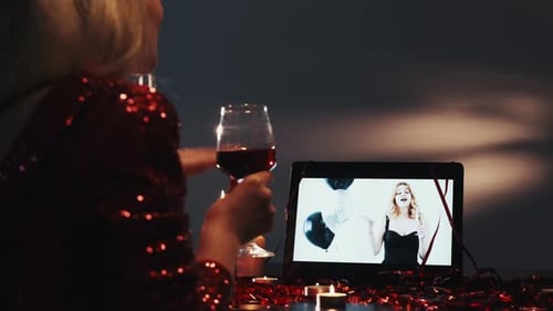 Woman Celebrates Birthday with Video Call and Wine