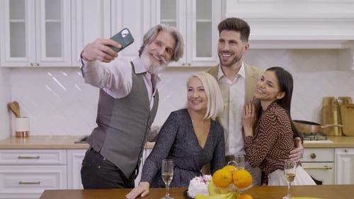 Family Celebrates Birthday in Kitchen and Takes Selfie