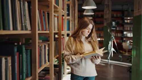 Girl Reading a Book in Cozy Library