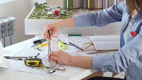 Woman Takes Notes Draws Sketches on Paper She Works As a Designer in an Office