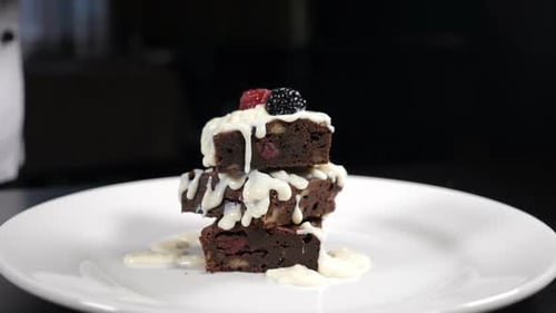 Stacked Brownies with Berries and Creamy White Sauce