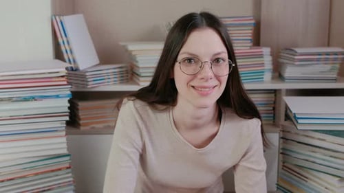 Smiling Woman with Books Indoors