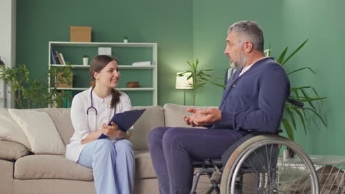 Friendly Healthcare Worker Visits Mature Adult Patient at Home