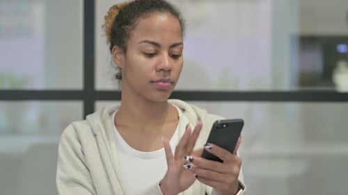 Woman Using Smartphone Indoors, Close Up