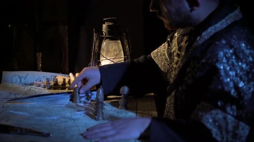 Chess Pieces on Map by Lantern Light