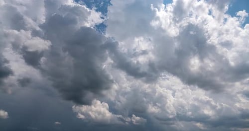 Dramatic Clouds Moving Across a Vivid Blue Sky
