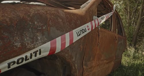 Damaged Vehicle Behind Police Tape