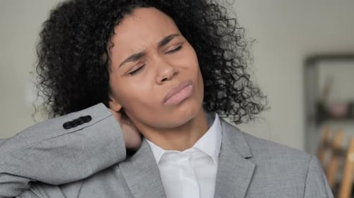 Neck Pain Portrait of Tired African Businesswoman