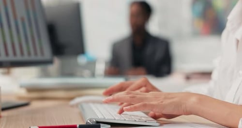 Closeup of a White Keyboard From a Computer Standing on a Wooden Desk on It a Working Woman Young