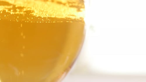 Refreshing Golden Drink With Rising Bubbles