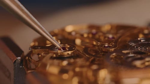 Assembling Intricate Golden Watch Mechanism with Precision Tweezers