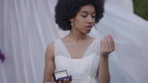 Smiling Woman with Wedding Ring and Jewelry Box
