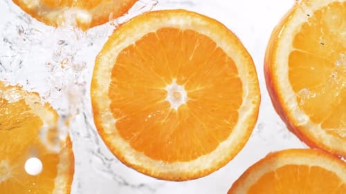 Orange Fruit Slices in Water Close Up