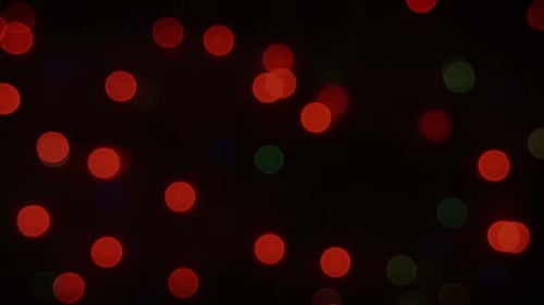 Blurred Red and Green Christmas Lights on Black