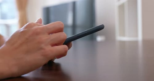 Close Up of Hands Operating a Smart Phone