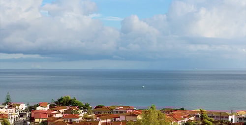 Coastal Town Overlooking the Ocean on a Cloudy Day