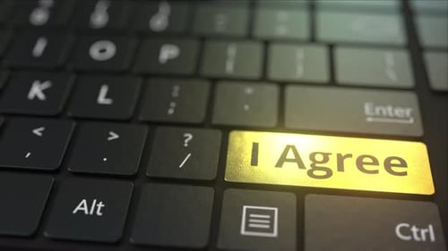 Clavier d'ordinateur noir et touche « J'accepte » dorée