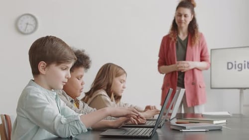 Children Using Laptop Computers in Classroom
