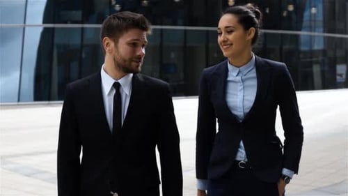 Businesspeople Have Conversation Outdoor in Business District