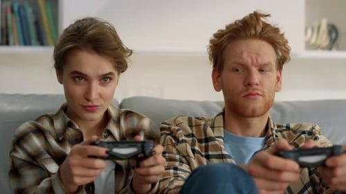 Couple Plays Video Games Together in Living Room