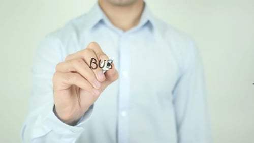 Man Writes Business Strategy with Marker