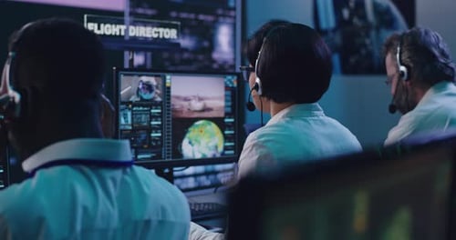 Multiracial Operators Working in Flight Control Center